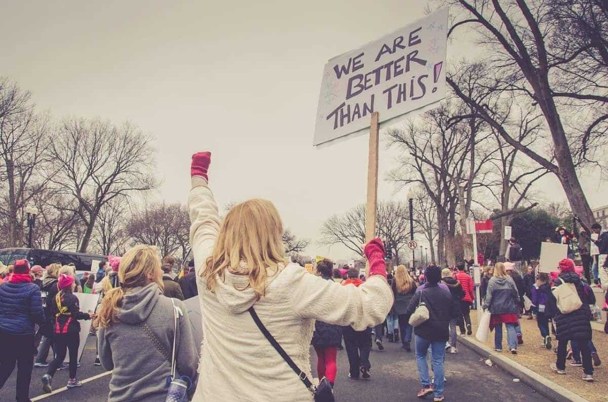 Woman holding sign at a protest